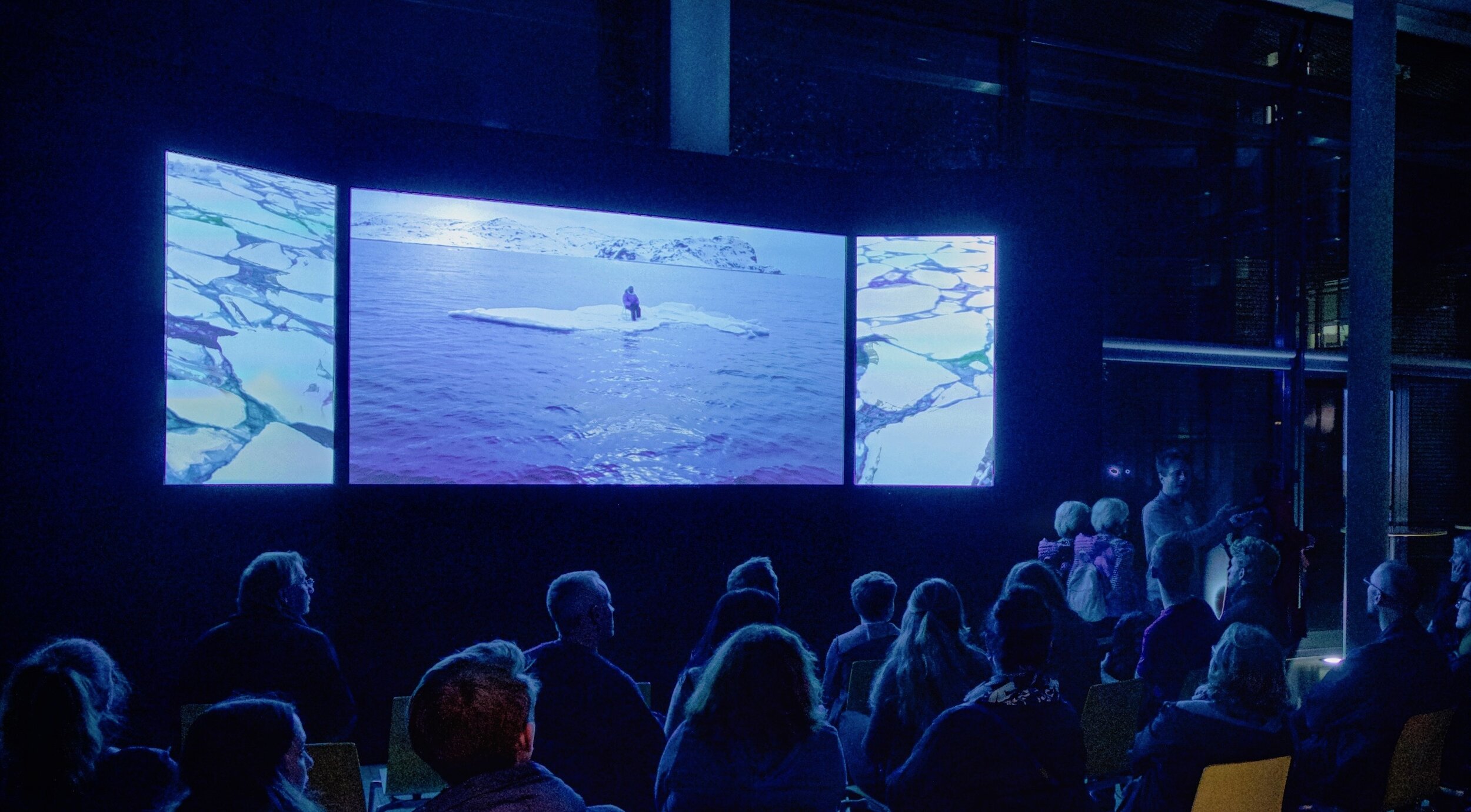 Installation view of Adam Sébire's video triptych AnthropoScene IV : Adrift (∆Asea-ice) at the Long Night of the Munich Museums, October 2019.